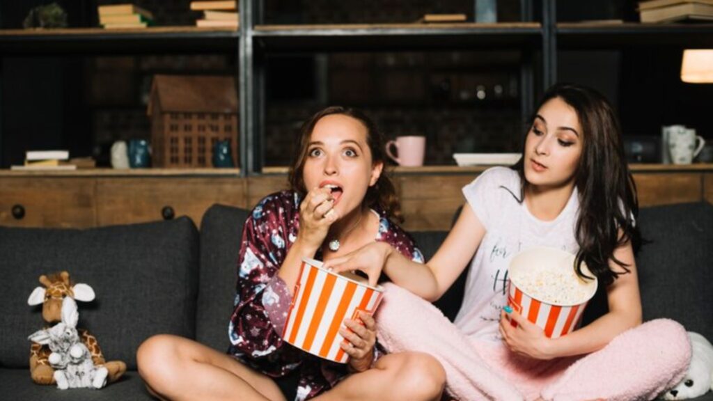 image showing two girls watching netflix